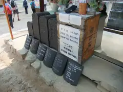 You can pay for prayers on roof tiles too