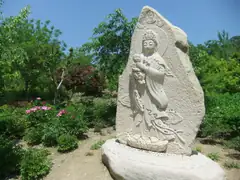 Goddess of mercy with donations