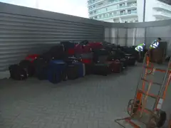 Baggage waiting to be shipped onboard